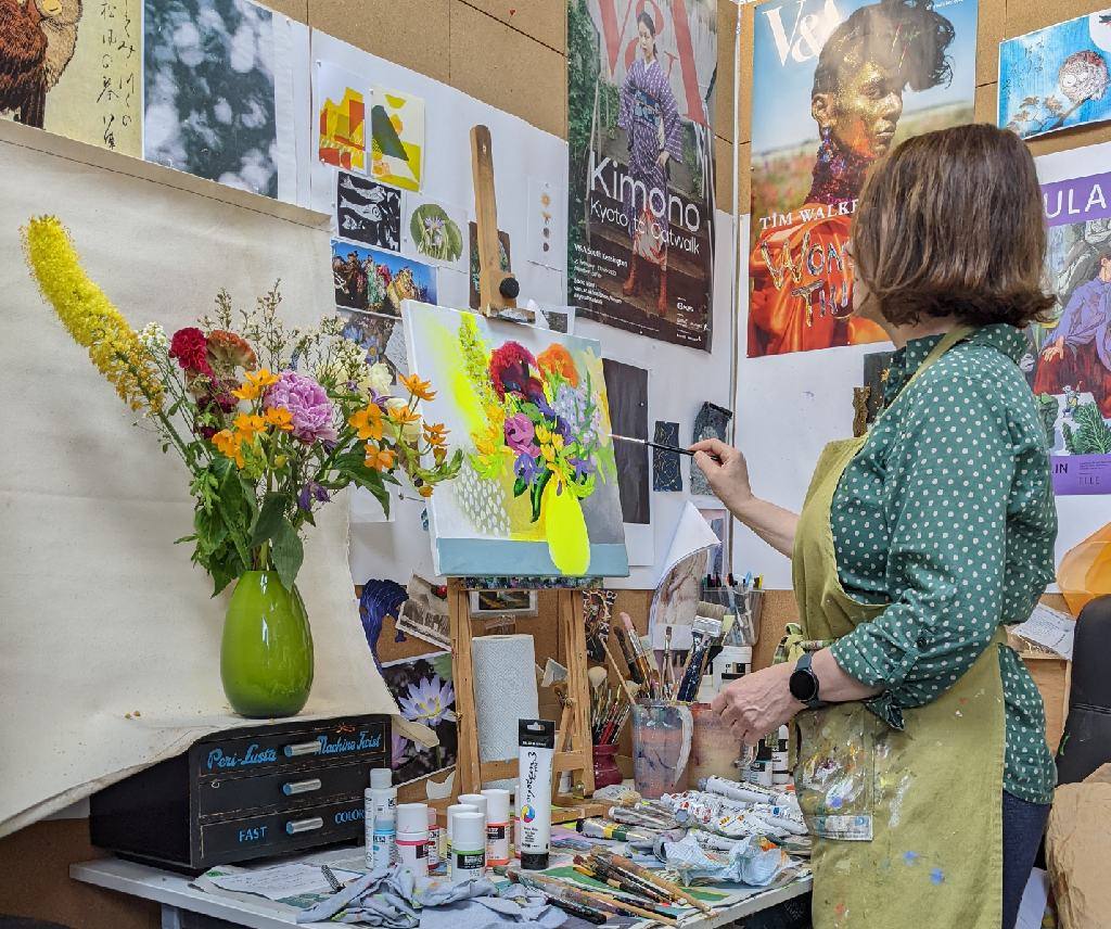 Artist Sara Button painting in her studio Artist Sara Button Painting in her Studio
